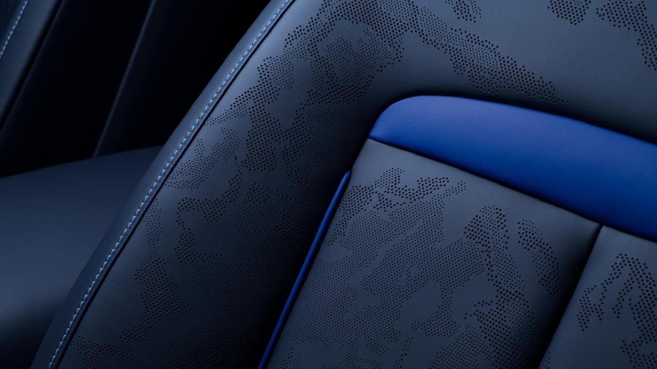 Seat with embroidered pattern and blue accent detail