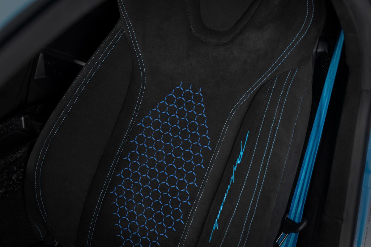 Laser-engraved hexagon pattern on an Alcantara backrest