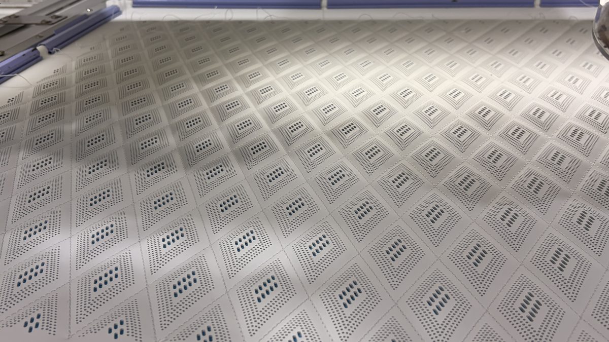 Perforated leather panel with a diamond pattern