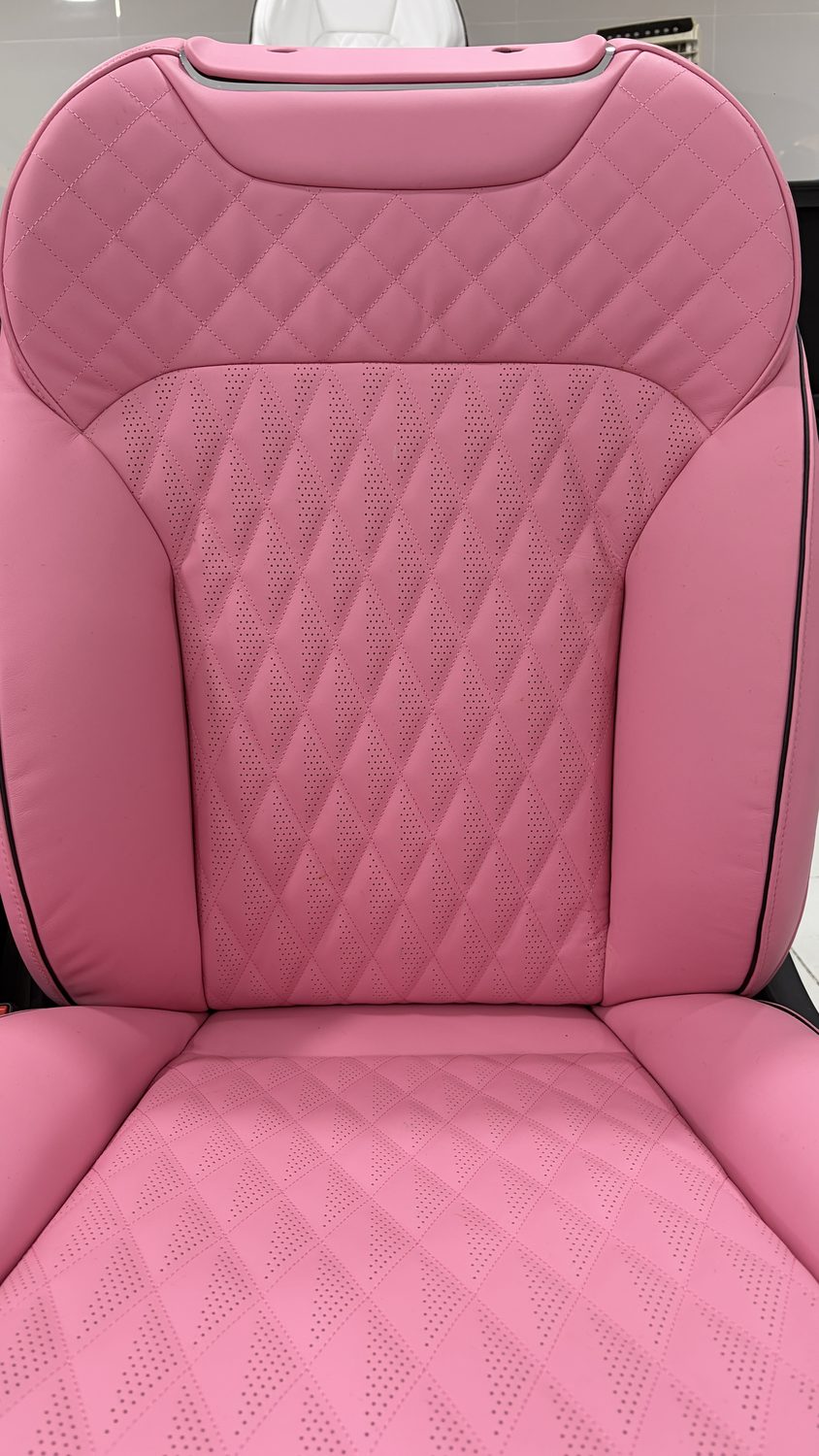 Diamond-quilted pink leather seat