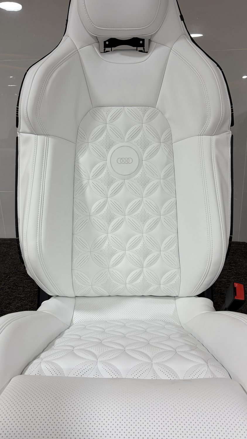 Quilted white leather seat with a textured centre panel